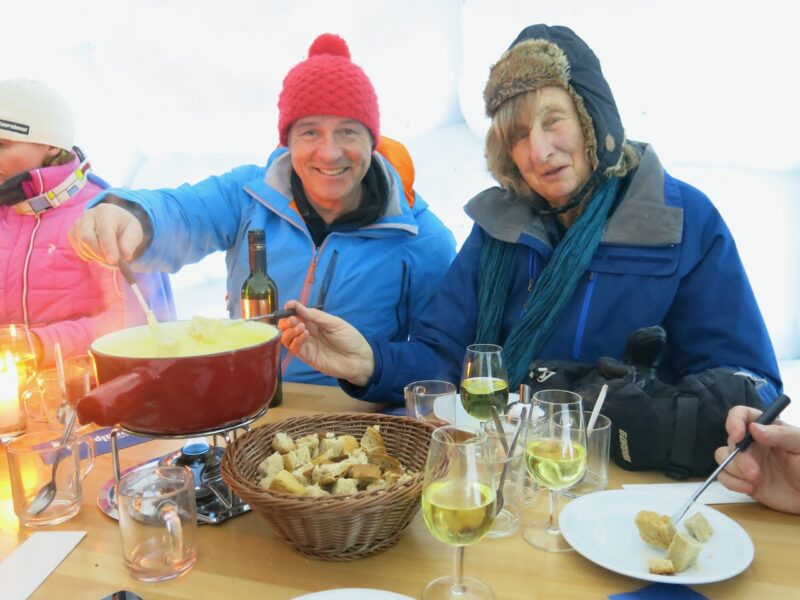 James and Minty enduring another cheese fondue. Image c/o PlanetSKI.